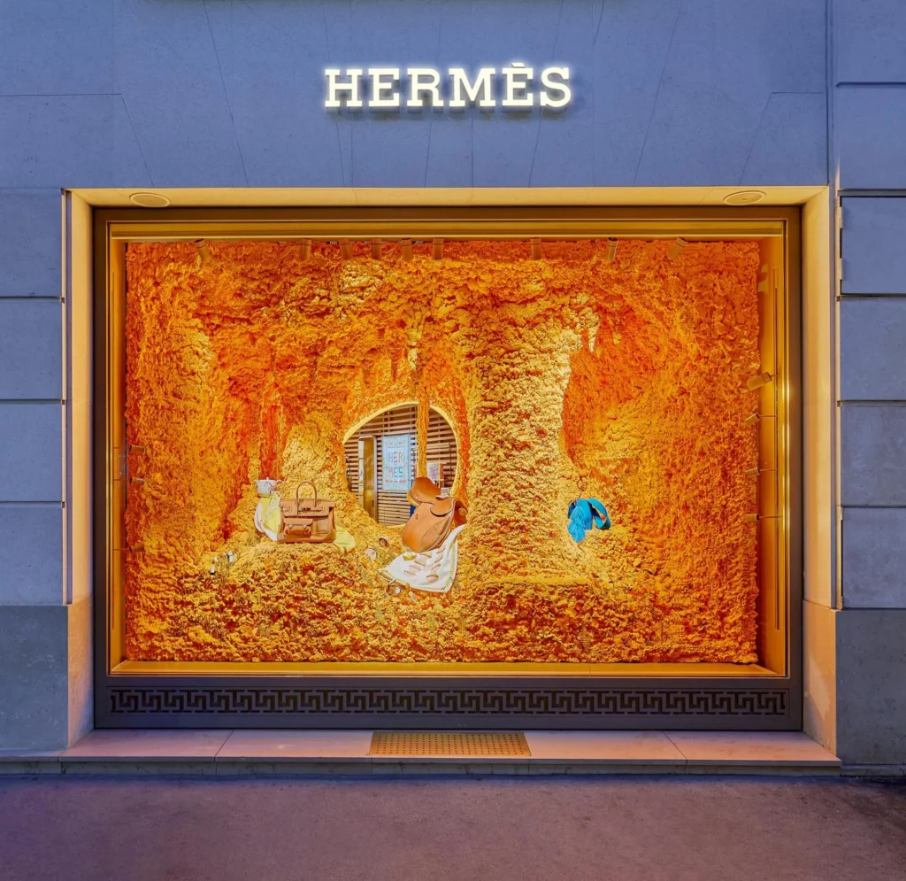 Hermès seasonal window design combining creativity, freshness and luxury with a contemporary aesthetic.